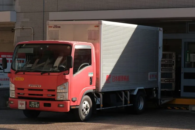 Delivery truck parked at a loading bay ready for goods to be loaded